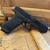 Glock 17 Gen 6 MOS full size 9mm pistol with optics ready slide and 17 round magazine pointing downward to the right, in store image