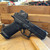 Glock 19 Gen 6 COA 9mm pistol with factory installed Aimpoint COA red dot optic angled downward to the right, in store image
