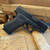 Glock 43X MOS optics ready 9mm sub-compact pistol with Glock Marksman Barrel and slimline frame pointed downward and to the right, in store image