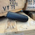 Stealth Additive Works SHIV 9mm titanium suppressor with direct thread mounting and lightweight 3D printed construction laying down, in store image
