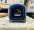 Aimpoint ACRO P-2 FDE enclosed red dot sight with 3.5 MOA reticle and rugged duty-ready construction, in store image dot view