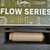 HUXWRX FLOW 556K flat dark earth suppressor with Flow-Through technology and included 1/2x28 quick detach flash hider, in store image in box