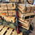 Zastava ZPAPM70 AK rifle chambered in 7.62x39 with 16.3-inch cold hammer-forged barrel, Serbian red wood furniture, and matte black finish, in store image angled upright