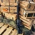 Sons of Liberty Gun Works M4-EXO3 AR-15 rifle chambered in 5.56 NATO with 16-inch barrel, M-LOK handguard, B5 furniture, and black anodized finish, in store image pointed upwards