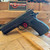 Dan Wesson DWX Compact 9MM optics-ready pistol with match-grade barrel, aluminum frame, tritium front sight, and black DLC finish, in store image angled downward