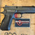 Dan Wesson DWX Compact 9MM optics-ready pistol with match-grade barrel, aluminum frame, tritium front sight, and black DLC finish, in store image pointing to the right
