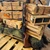 Mossberg 590S Shockwave 12 gauge pump action firearm featuring WOOX Gladiatore American walnut grip and M-LOK forend upgrade, matte blue finish, 14.375-inch barrel, and compact defensive configuration, in store image pointing upwards