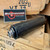 HUXWRX FLOW 9K Ti 9mm suppressor with black Cerakote finish, titanium construction, Flow-Through technology, and 1/2x28 booster assembly installed for pistol and PCC use in store image angled thread view