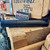 AAC Ti-RANT 9M HD modular 9mm suppressor with Black PVD finish, titanium and stainless steel construction, configurable full or compact length, and multi-caliber compatibility, in store image side view