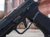 Agency Arms x Sage Dynamics SIG Sauer P320F 9mm pistol in black featuring the Agency Optic System, integrated Sage compensator, Icarus Precision grip module, and suppressor-height sights,
