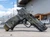 Agency Arms x Sage Dynamics P320 9mm pistol in MultiCam Black featuring the Agency Optic System, Sage compensator, Icarus Precision grip module, and suppressor-height sights.