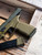 Agency Arms x Sage Dynamics SIG Sauer P320 9mm pistol in ODG Nitride featuring the Agency Optic System, integrated Sage compensator, Icarus Precision grip module, and suppressor-height sights, in store left side with slide locked angled view