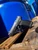 Canik METE MC9 Prime Radian 9mm black pistol with Radian RAMJET barrel and AFTERBURNER compensator, outside against blue background with sunlight
