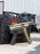 HK SP5K-PDW 9mm pistol with 5.83 inch threaded tri-lug barrel and Bazooka Green Cerakote finish against bag