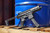 Sig Sauer MPX 9mm short-barreled rifle with 4.5 inch barrel folding stock and black M-LOK handguard, pointed to the right