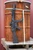 HK SP5 9mm short-barreled rifle with fixed stock, HUXWRX FLOW 9K Ti suppressor, Aimpoint Micro T-2 optic and SureFire Scout Light, outside upright