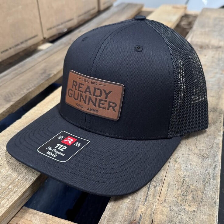Ready Gunner black trucker hat with leather logo patch and adjustable snapback closure