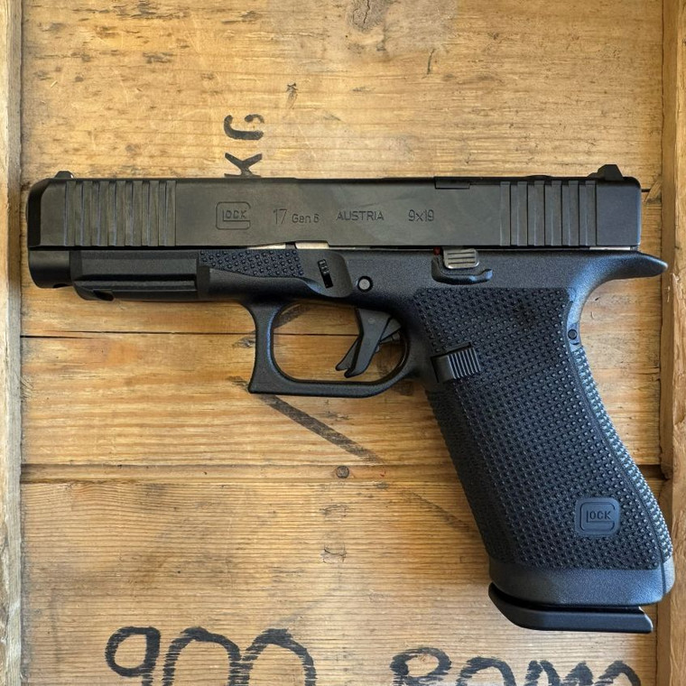 Glock 17 Gen 6 MOS full size 9mm pistol with optics ready slide and 17 round magazine pointing to the right, in store image