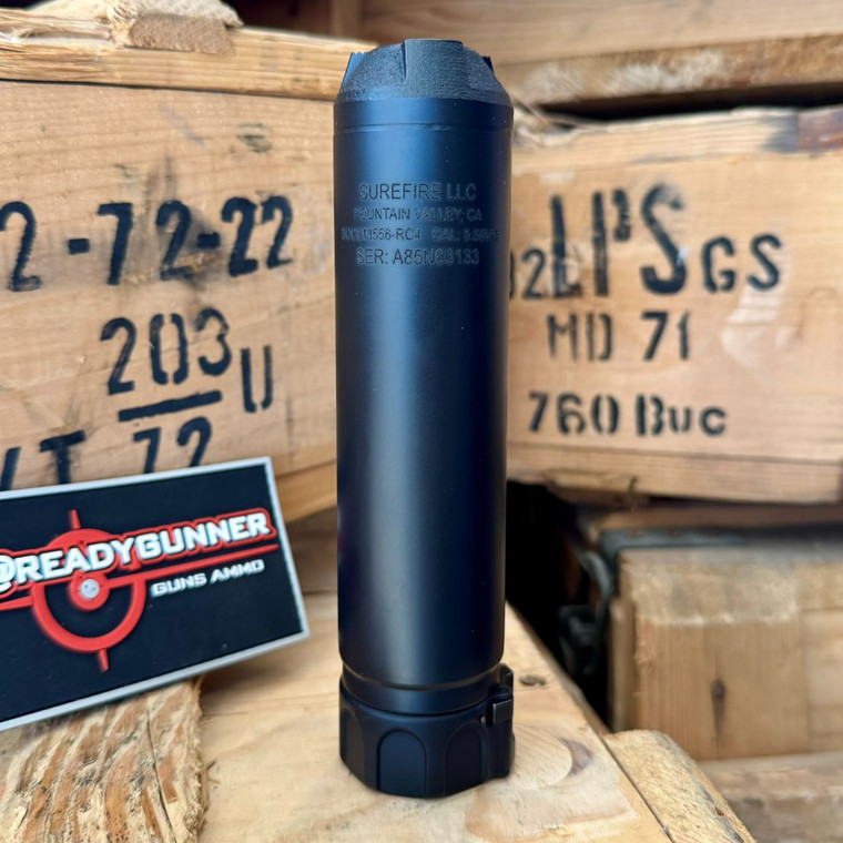 SureFire SOCOM556-RC4 5.56 NATO suppressor in black featuring full Inconel construction, Fast-Attach mounting system, low back-pressure design, and advanced flash reduction technology, in store image upright