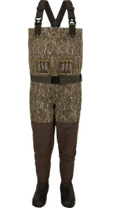 Drake Insulated Guardian Elite Vanguard Breathable Wader with 1600-gram Thinsulate Ultra Insulation, sewn-in liner, reinforced knee and shin pads, Bottomland camo pattern, and no-buckle X-Cross shoulder straps for waterfowl hunting in extreme cold and rugged terrain Drake Insulated Guardian Elite Vanguard Breathable Wader with 1600-gram Thinsulate Ultra Insulation, sewn-in liner, reinforced knee and shin pads, Bottomland camo pattern, and no-buckle X-Cross shoulder straps for waterfowl hunting in extreme cold and rugged terrain