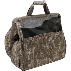 Drake Waterfowl Guardian Elite Wader Bag in Mossy Oak Bottomland camouflage, waterproof HD2 material with breathable mesh panels, side boot pockets, and padded shoulder strap for secure transport of waterfowl hunting waders, boots, and outerwear