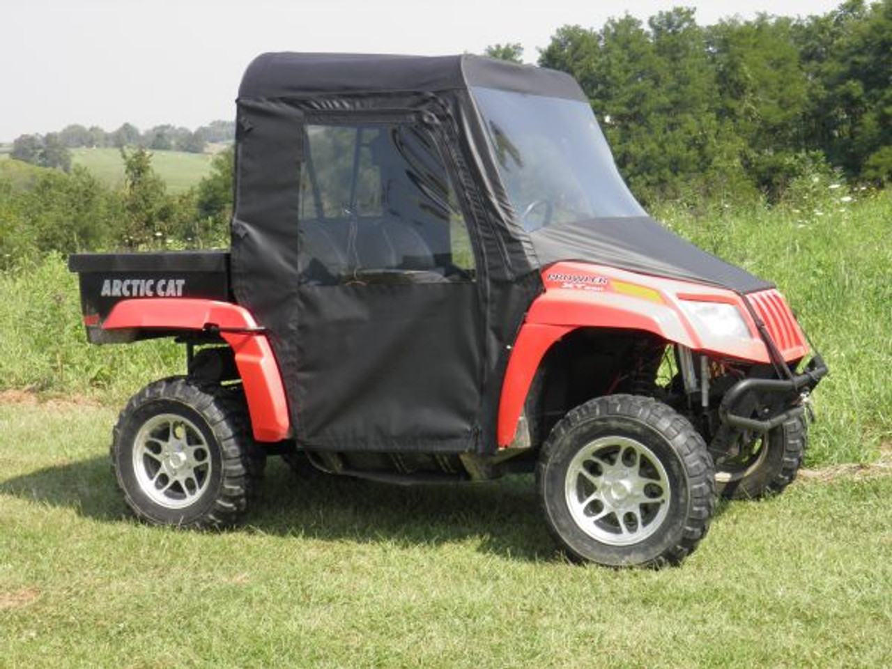 Full cab enclosure with vinyl windshield side view
