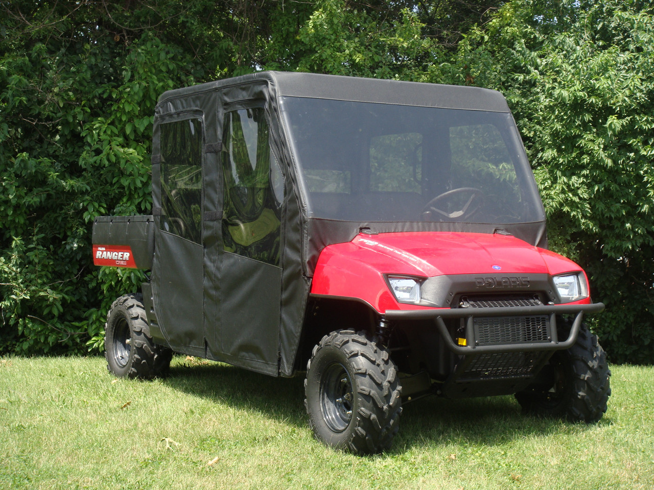 3 Star side x side Polaris Ranger Crew 700 full cab enclosure with vinyl windshield front and side angle view