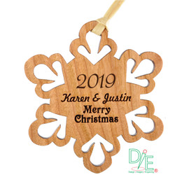 Wooden Snowflake Ornament made from Solid Cherrywood.  Hand sanded and finished with clear coat.