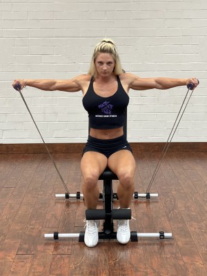 woman doing Shoulders exercise with intense resistance band holding intense resistance bands handle grips on intense band adjustable exercise bench