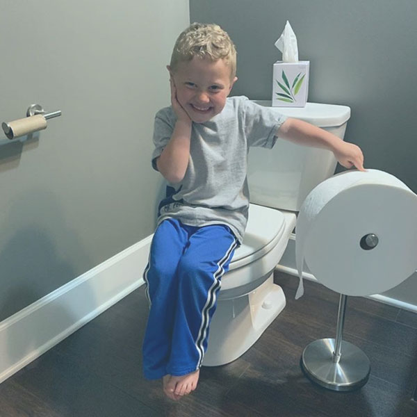 Child pointing to Charmin Forever Roll