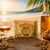 Tortuga Golden Original Snack Rum Cake in a tropical scene.