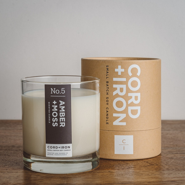 Experience the captivating allure of the Amber and Moss Candle by Cord and Iron. This 10 oz soy candle combines earthy scents of amber and moss, offering a natural and eco-friendly fragrance that brings warmth and tranquility to any space.