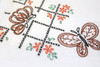 Aunt Martha’s #3437 Butterflies and Cross Stitch iron-on embroidery transfer pattern featuring seven vintage butterfly designs with decorative borders for days-of-the-week tea towels.