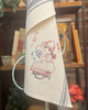Vogart® Hand Stitch Iron-on Embroidery Transfer Pattern #672 Dutch Treat stitched onto Aunt Martha's® retro bold striped kitchen towels.