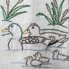 Stitcher’s Revolution® Northwoods Lodge iron-on embroidery transfer pattern featuring cabin, wildlife, and camping scenes (SKU SR46)