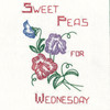 Vogart #215 A Flower A Day for Your Kitchen vintage iron-on Days of the Week embroidery transfer pattern featuring seven floral designs and smaller motifs for potholders and guest towels.