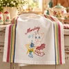 Vintage Days of the Week Pixie embroidery designs hand stitched on white flour sack kitchen tea towels using Aunt Martha's® #699 iron-on embroidery transfers.