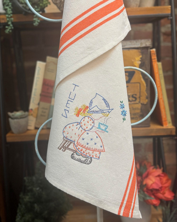 Vogart® Hand Stitch Iron-on Embroidery Transfer Pattern #672 Dutch Treat stitched onto Aunt Martha's® retro bold striped kitchen towels.