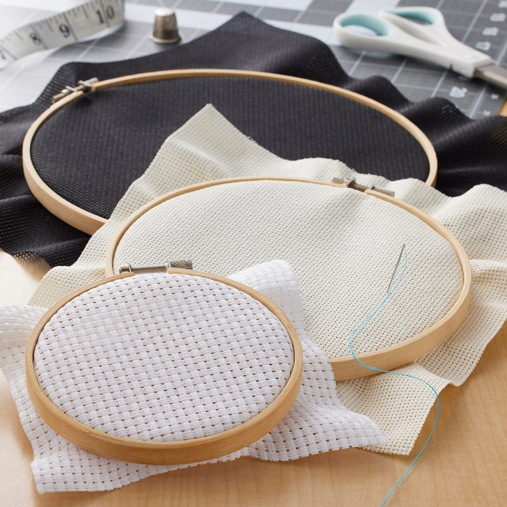 Close-up of renewable bamboo embroidery hoop with smooth clasp detail.