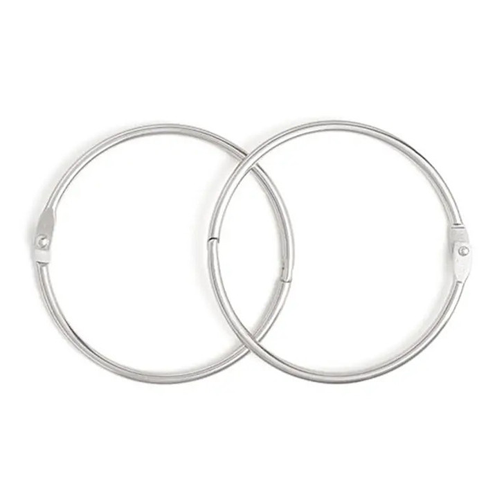 Two silver hinged bobbin rings from DMC lying side by side.