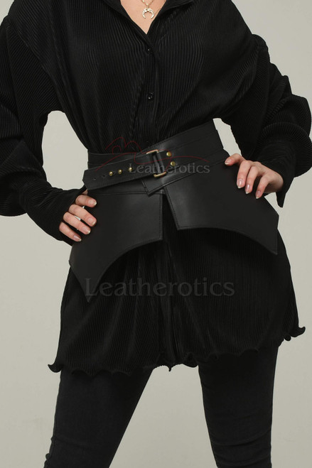 Black adjustable leather obi belt over black dress, front view