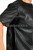 Close-up of perforated leather on men's black T-shirt sleeve