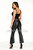 Black flared crop leather pants with crop top, full length front view