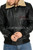 Men's black cowhide aviator jacket with fur collar, front close-up