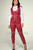Red leather waistcoat with matching red trousers, full length front