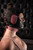 Black and pink leather women's hood with pink ear pads, side view