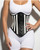 Black and white striped leather underbust waist cincher worn over white bodysuit, front