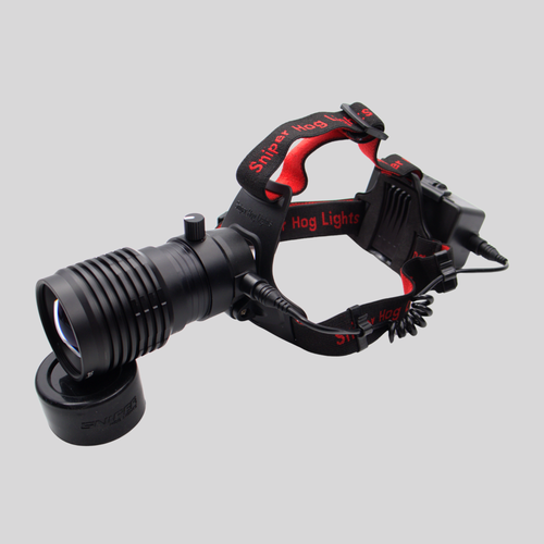 Sniper Hog Lights 50KAP rechargeable focusable LED headlamp with adjustable head strap and rear battery pack.