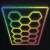 Westgate Manufacturing RGB Hex Car Shop Decorative Light Kit with Frame, 96 inches by 190 inches, featuring a hexagon pattern with colorful RGB lighting in blue, green, yellow, orange, and red, controlled by app or remote, model HEX-96X190-RGB-RC-BT.