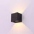 Westgate Manufacturing Wall Cube with Adjustable Beam Angle Up/Down Lights, 15W, available in 2700K, 3000K, 3500K, 4000K, and 5000K, mounted on a wall creating a dual light and shadow effect.